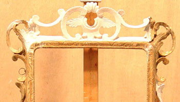 Mirror frame before restoration of carved moulding.