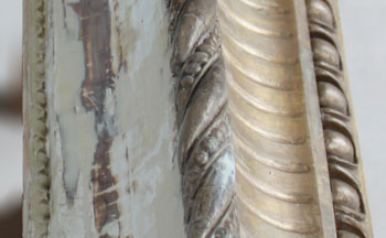 Detail of restoration work on the gilded frame
